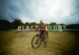 Nick Kelly on his bicycle at Glastonbury